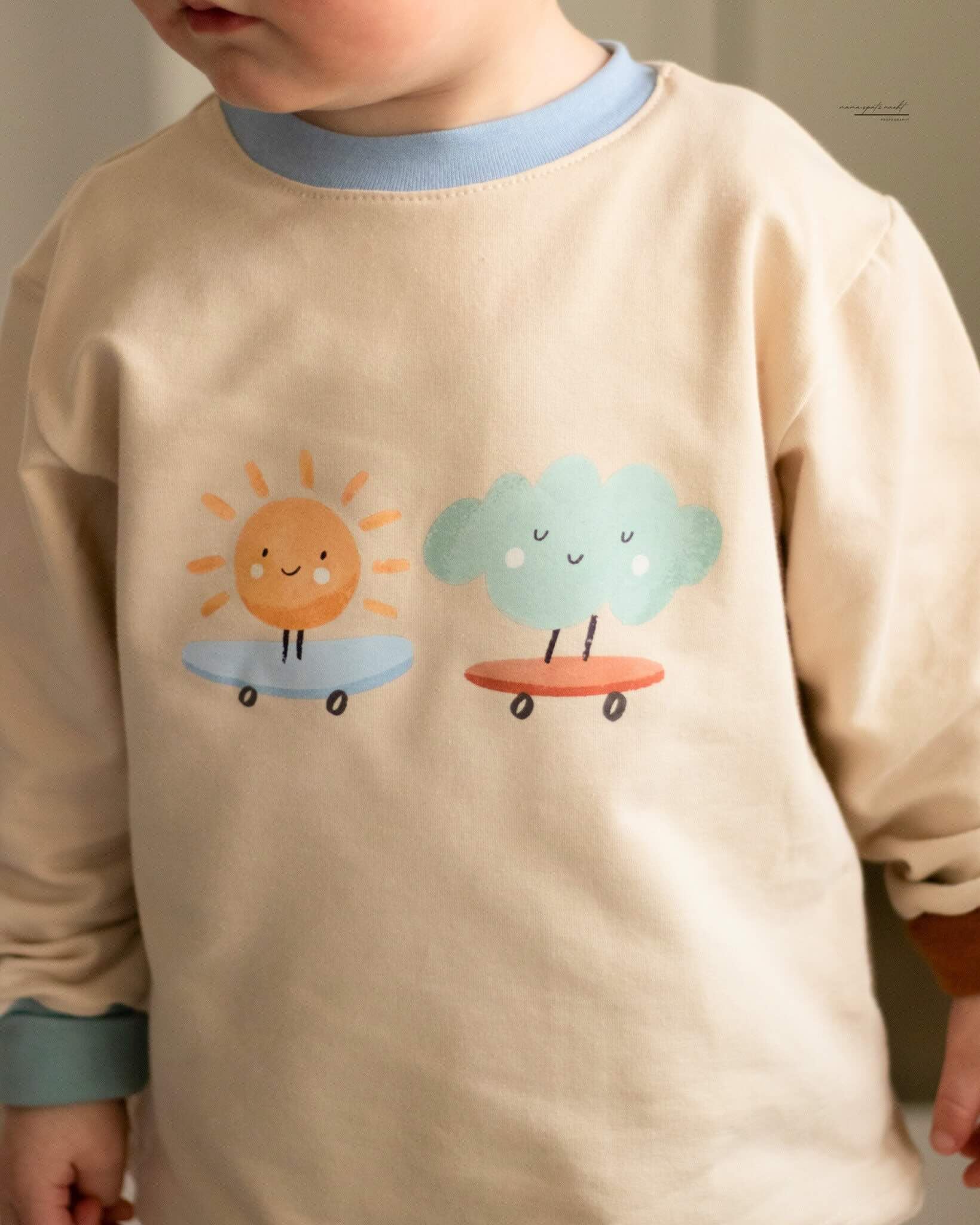 Kind mit Bügelbild Wolke