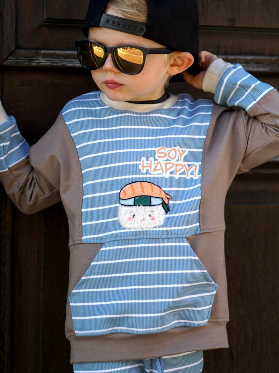 Kind mit Flauschi-Patch Nigiri