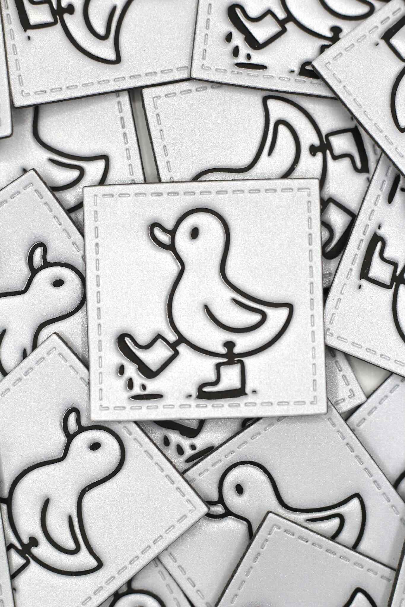 Reflektor Kunstlederlabel mit Enten Design