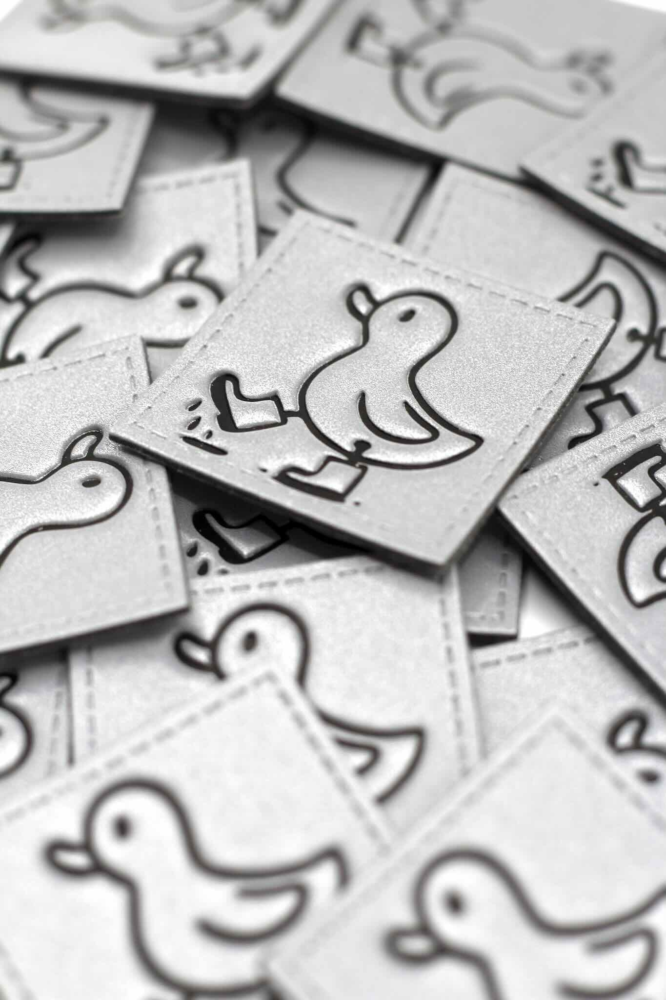 Reflektor Kunstlederlabel mit Enten Design