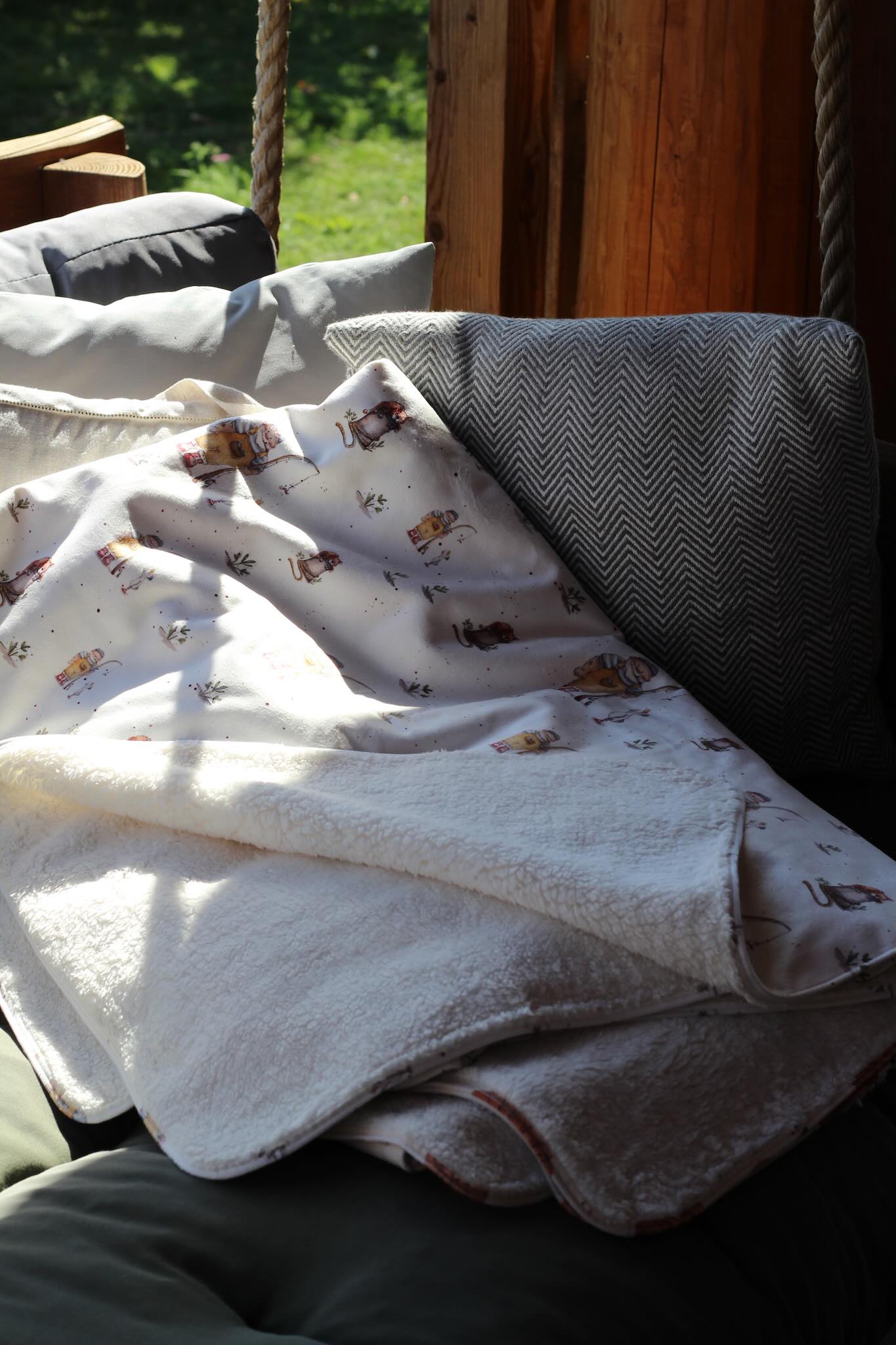 Sherpa-Fleece Decke im Tönn Tüdelhaken Design